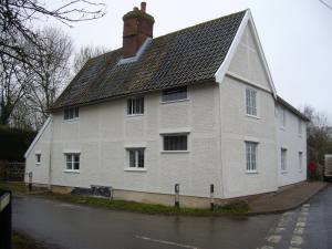 Restored historic house featuring a white pargetted lime render finish using FibreChalk